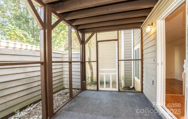a view of a room with large windows