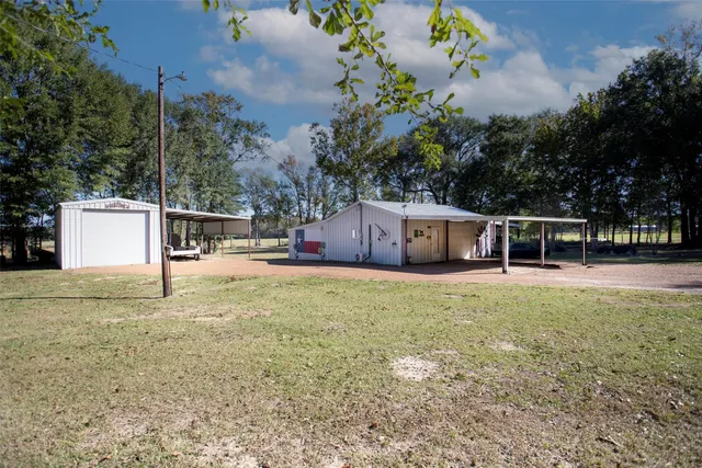 a view of a patio with swimming pool table and chairs