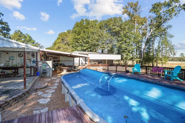 a view of a house with a tree in the background