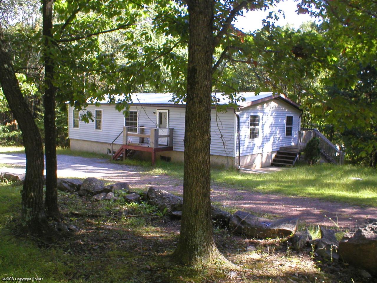a view of house with backyard