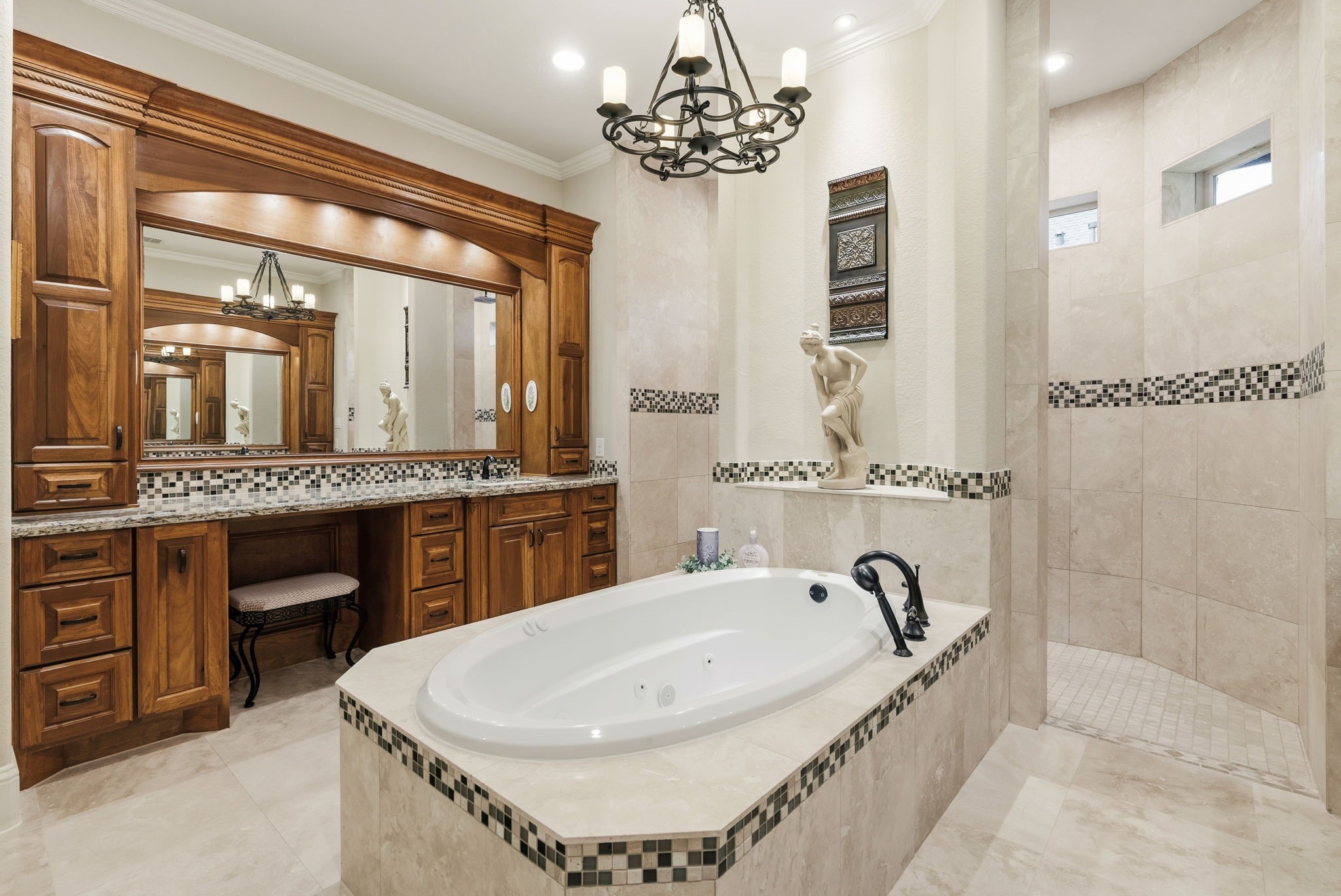 28502 Crawford Ridge Court Huffman, TX 77336 - Photo 26 of 50 a bathroom with a tub a double vanity sink a mirror and a shower