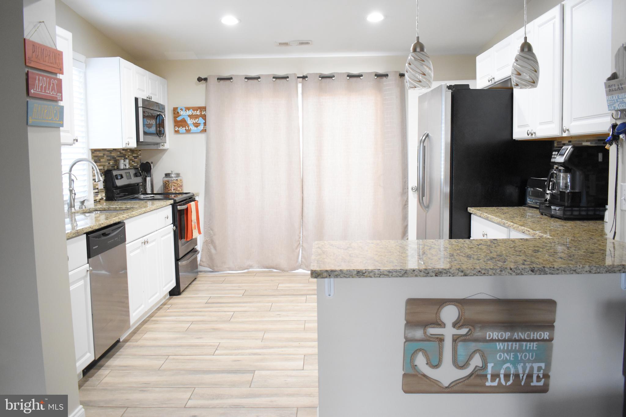 1311 4th Road Baltimore, MD 21220 - Photo 3 of 23 kitchen, granite counter tops and S.S. Appliances