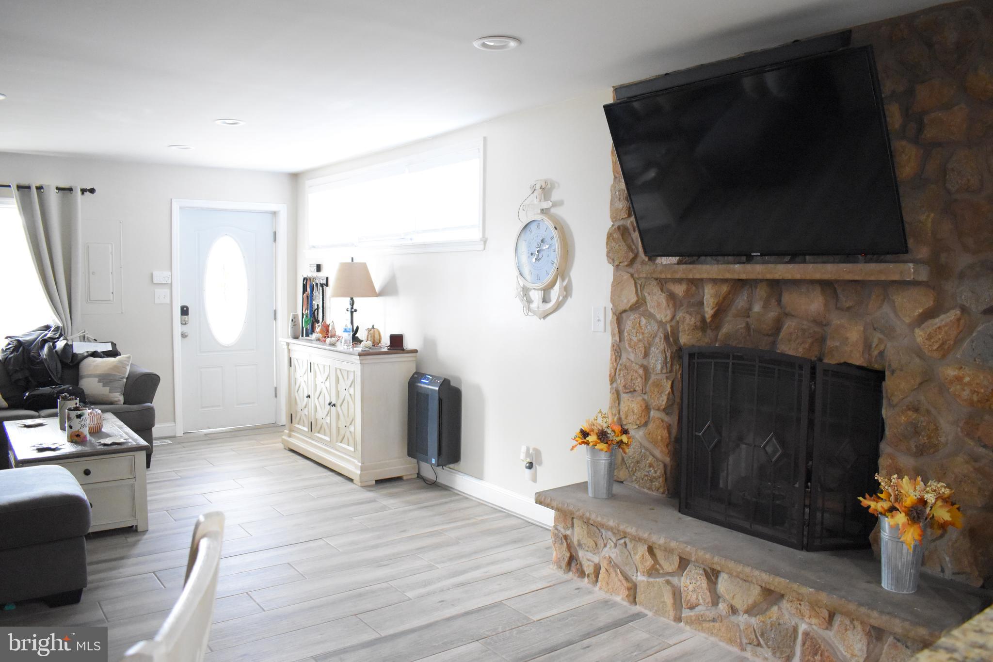1311 4th Road Baltimore, MD 21220 - Photo 8 of 23 stone fireplace true wood burning fireplace