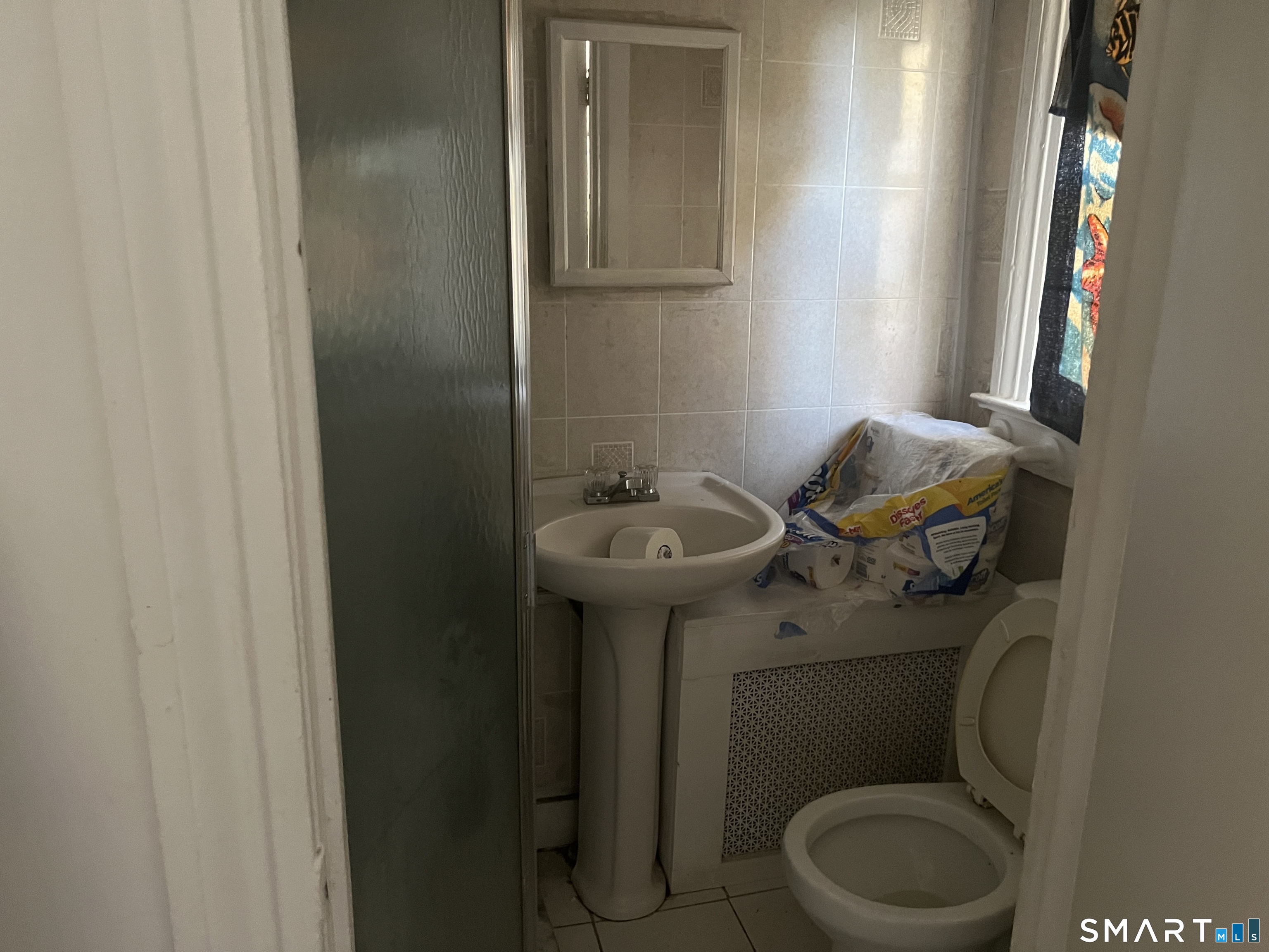 275 Long Ridge Road Stamford, CT 06905 - Photo 36 of 40 a bathroom with a toilet sink and mirror