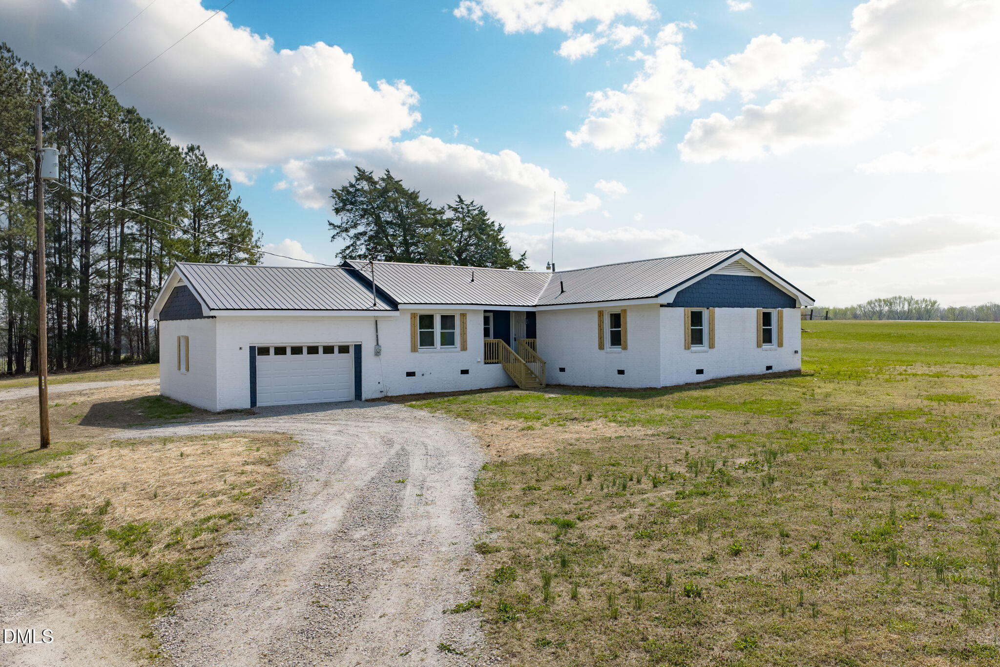 426 Rooker Dairy Road Norlina, NC 27563 - Photo 32 of 33 a house with huge green field in front of it