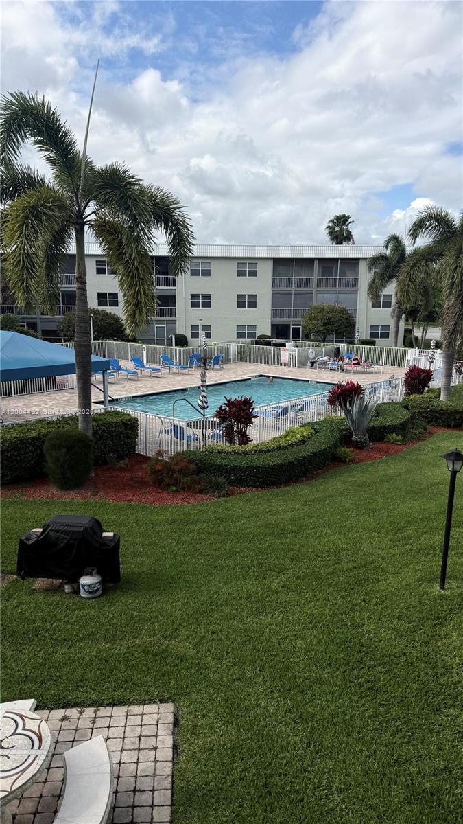 9880 Marina Boulevard, Unit 1528 Boca Raton, FL 33428 - Photo 1 of 14 a view of a house and a yard