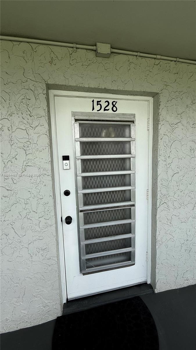 9880 Marina Boulevard, Unit 1528 Boca Raton, FL 33428 - Photo 11 of 14 a view of a utility room with washer and dryer