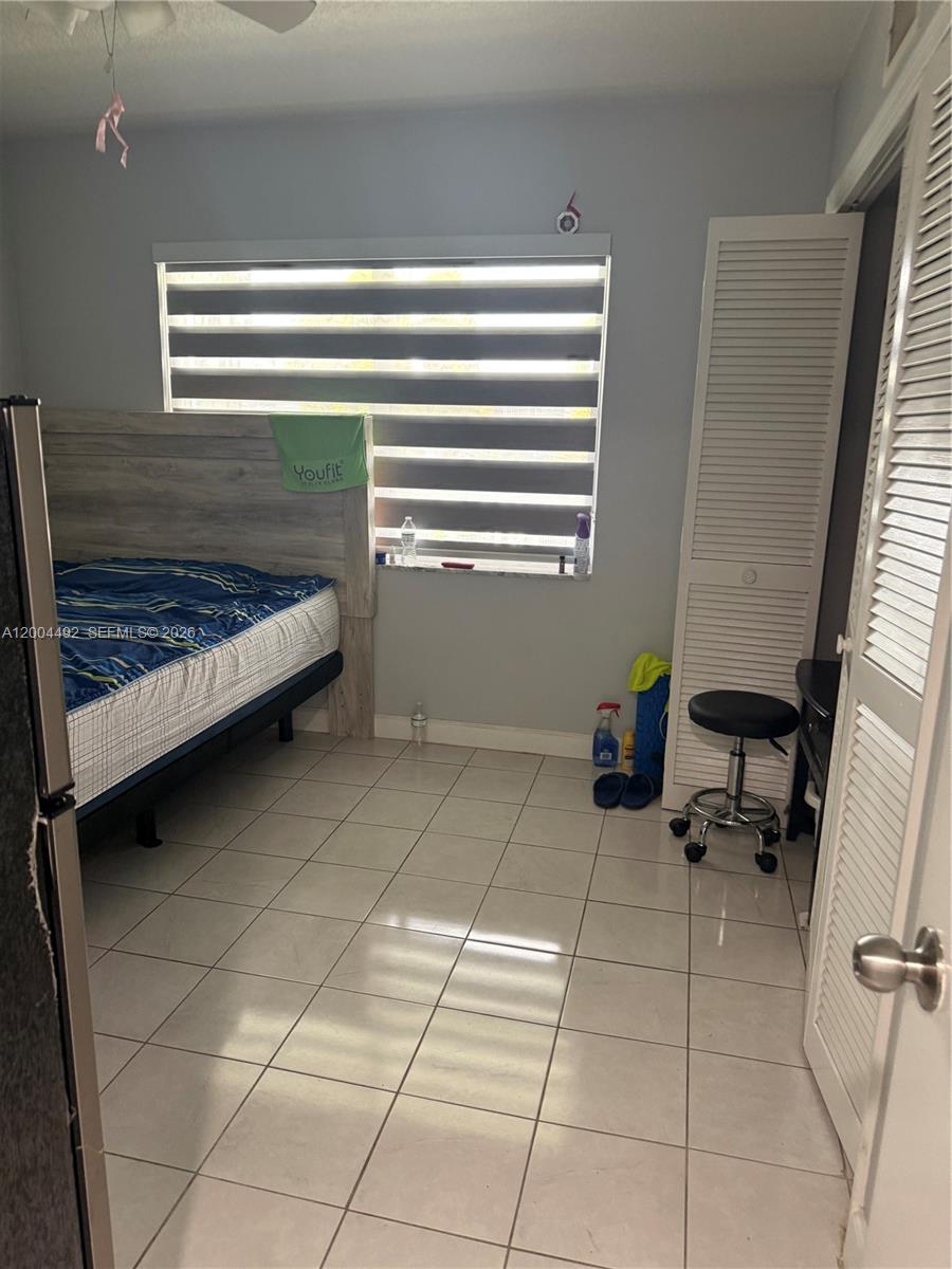 9880 Marina Boulevard, Unit 1528 Boca Raton, FL 33428 - Photo 13 of 14 a room with furniture and a window