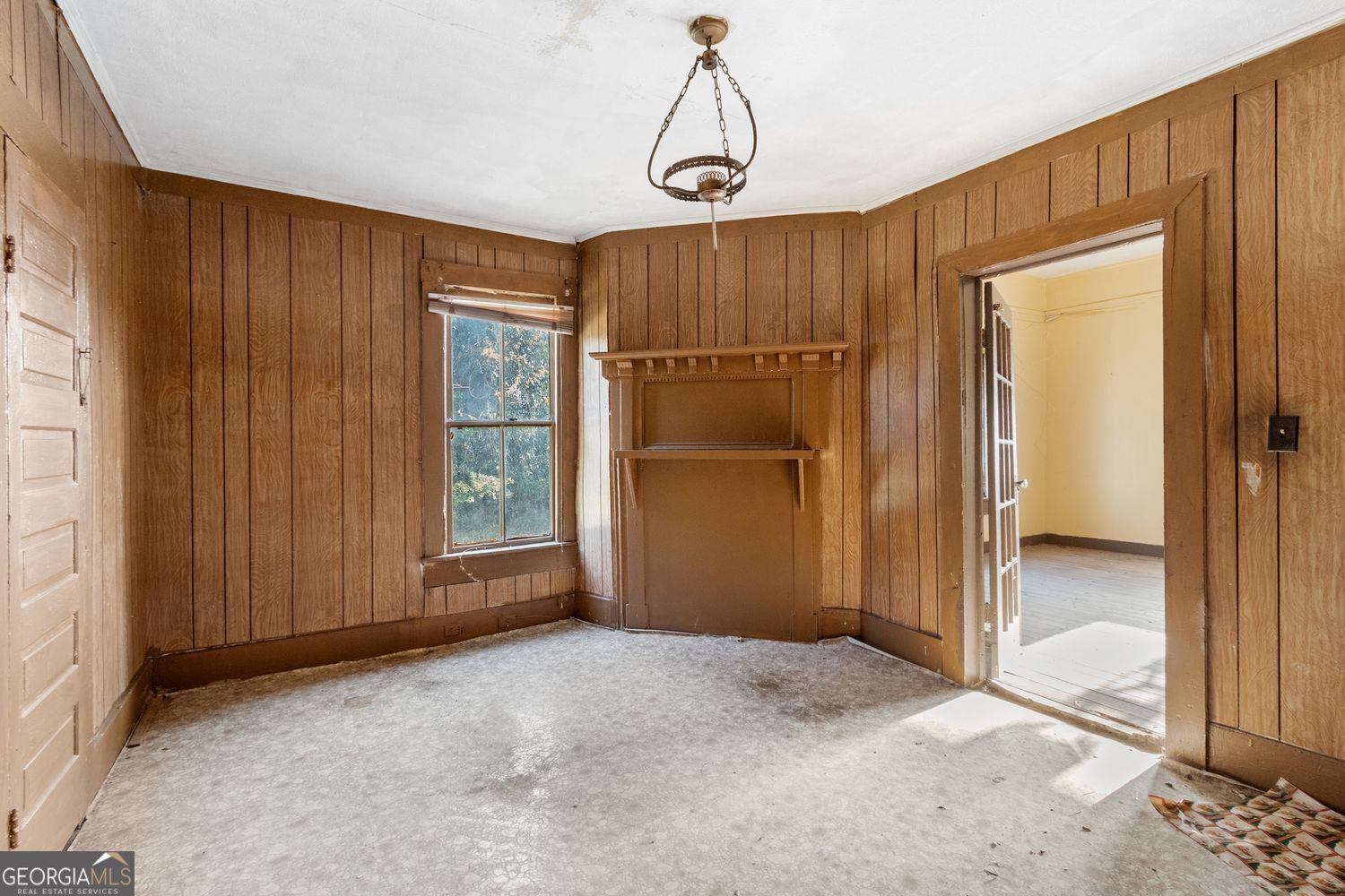 812 Effie Street Waycross, GA 31501 - Photo 11 of 12 a view of an empty room with a window