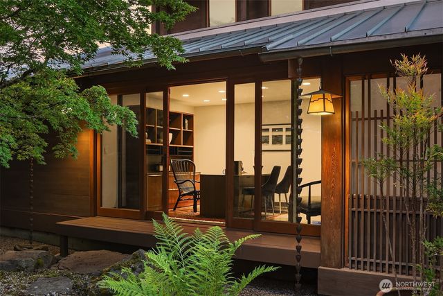 a view of a patio with table and chairs and potted plants