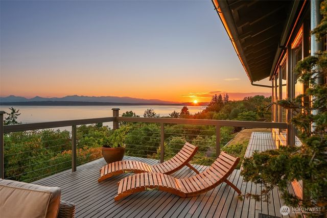 a view of a balcony with lake view and mountain view