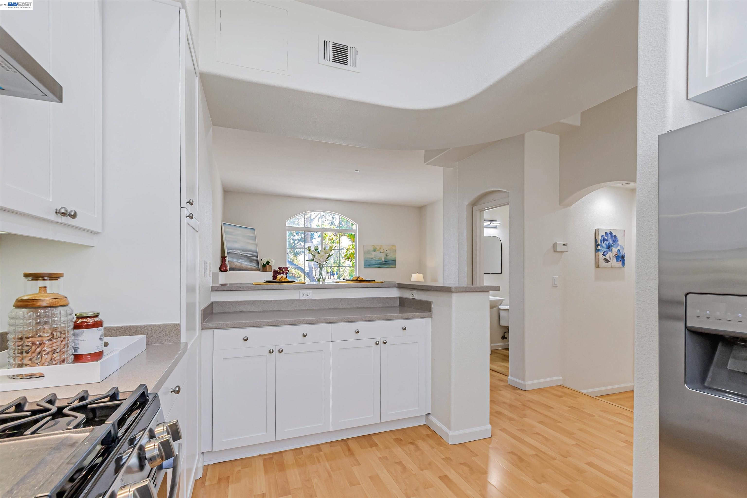 39 Cloud Walk Milpitas, CA 95035 - Photo 12 of 39 a kitchen with granite countertop a sink stove and cabinets