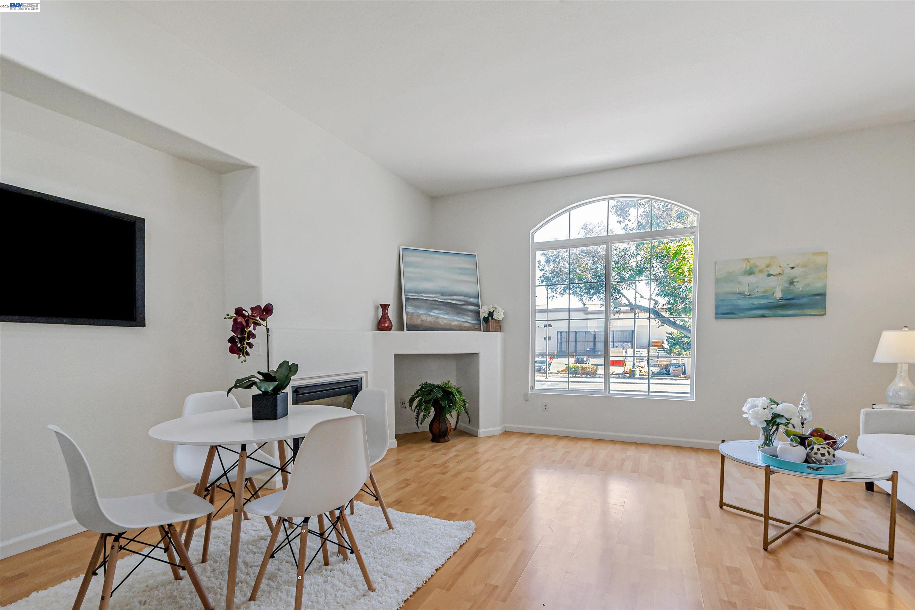 39 Cloud Walk Milpitas, CA 95035 - Photo 15 of 39 a living room with furniture a fireplace and a flat screen tv