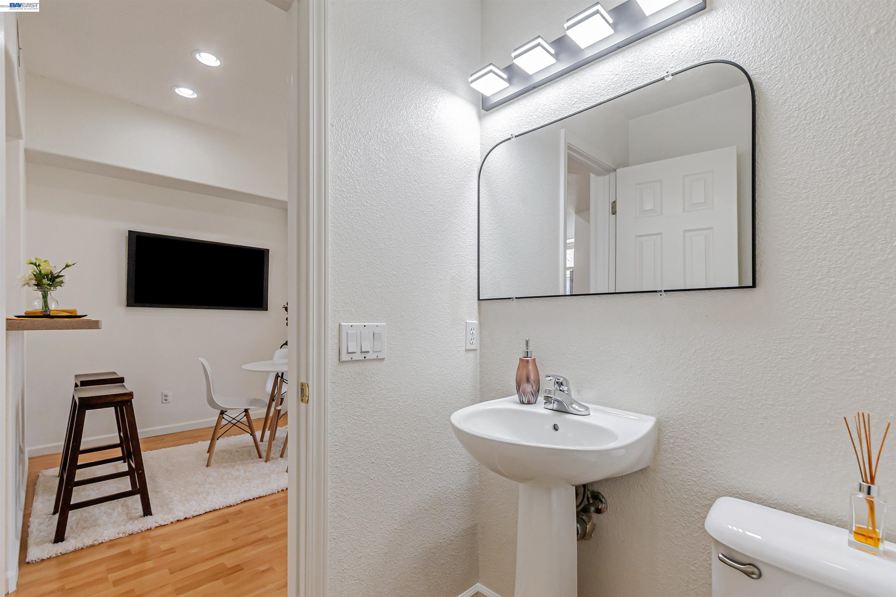 39 Cloud Walk Milpitas, CA 95035 - Photo 25 of 39 a bathroom with a sink a mirror and a toilet