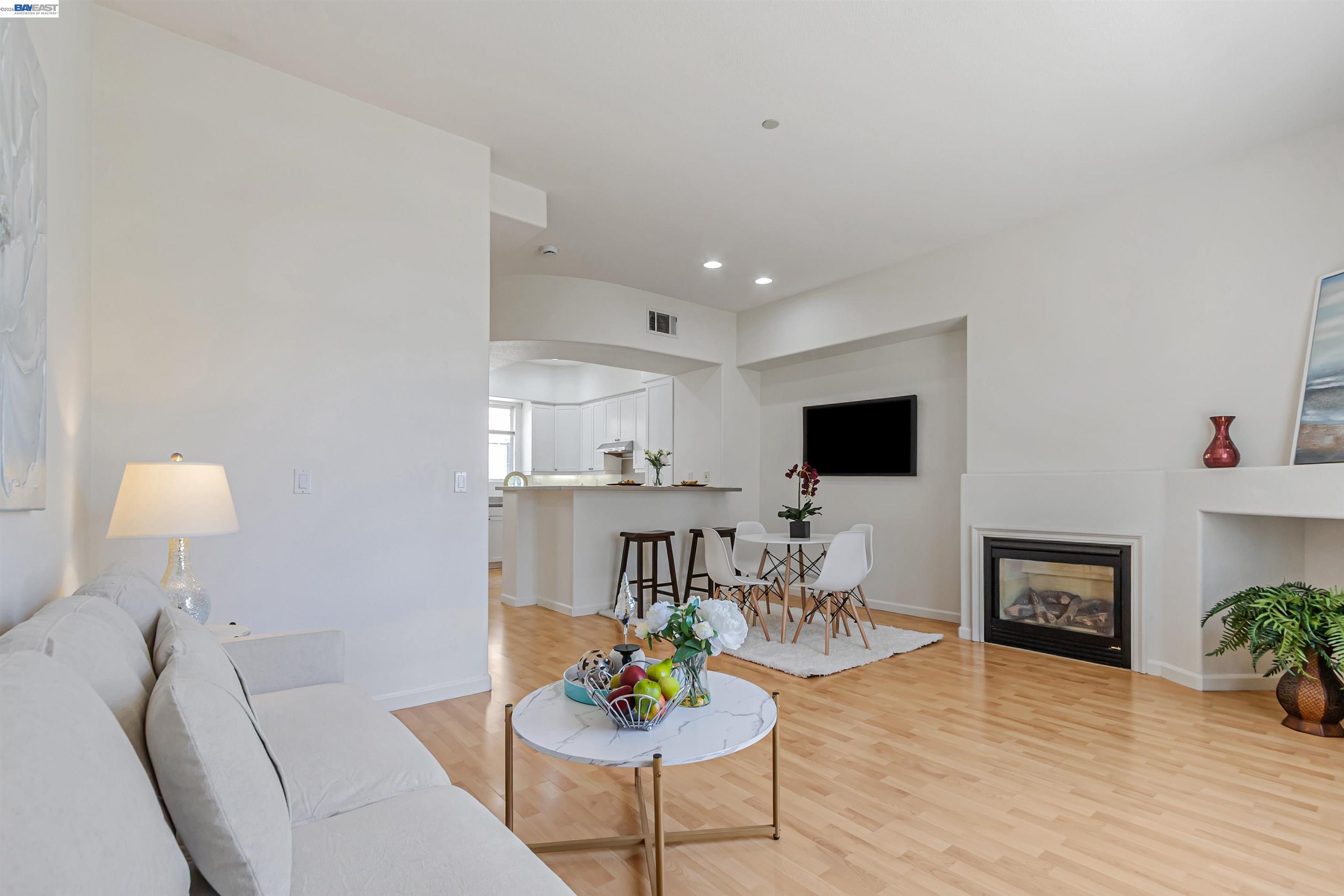 39 Cloud Walk Milpitas, CA 95035 - Photo 5 of 39 a living room with furniture a flat screen tv and a table