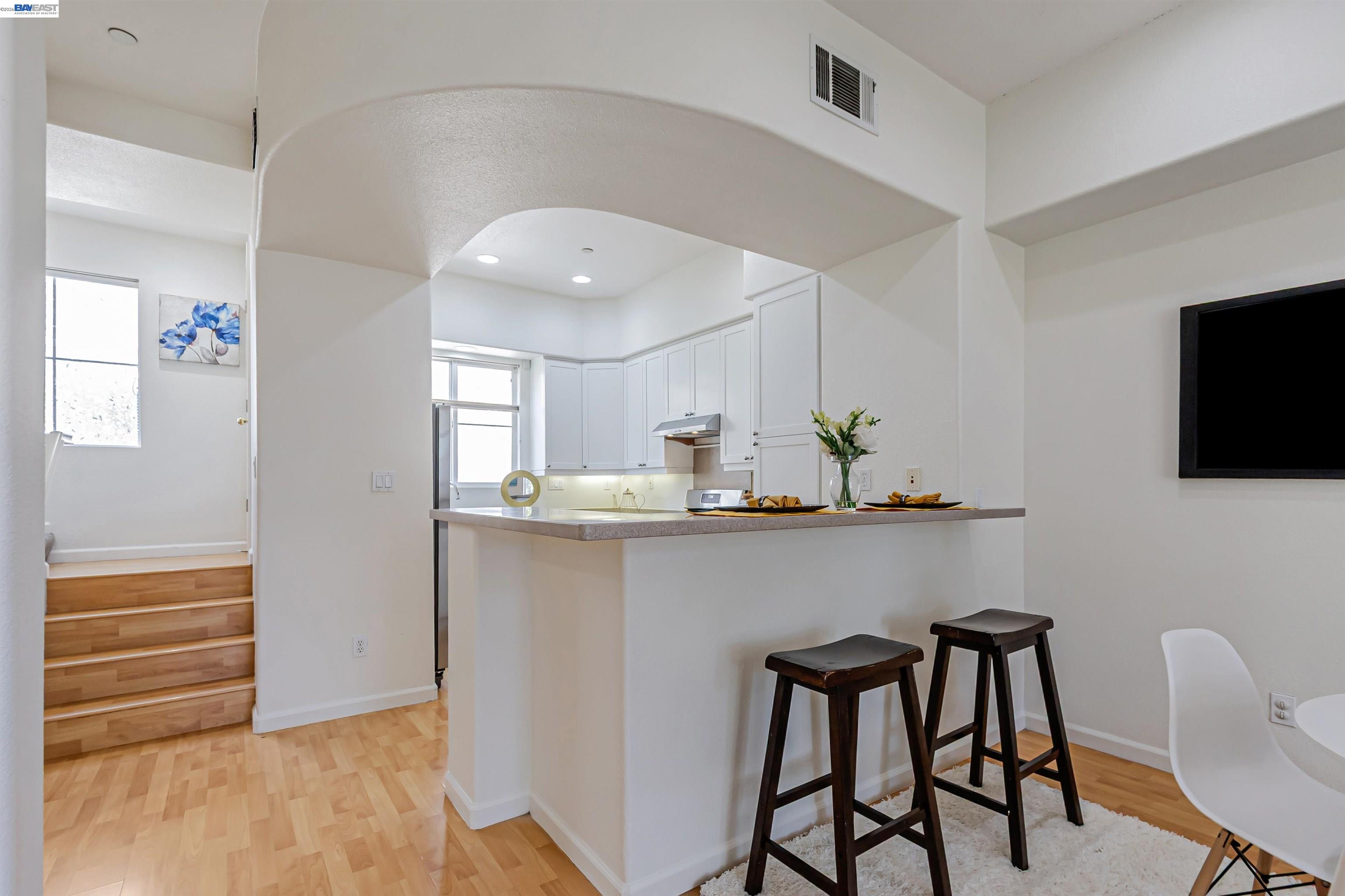 39 Cloud Walk Milpitas, CA 95035 - Photo 7 of 39 a kitchen with stainless steel appliances a sink cabinets and microwave
