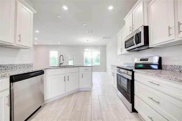 a view of room with window and hardwood floor