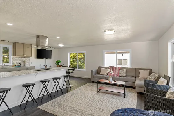 a living room with furniture and a rug