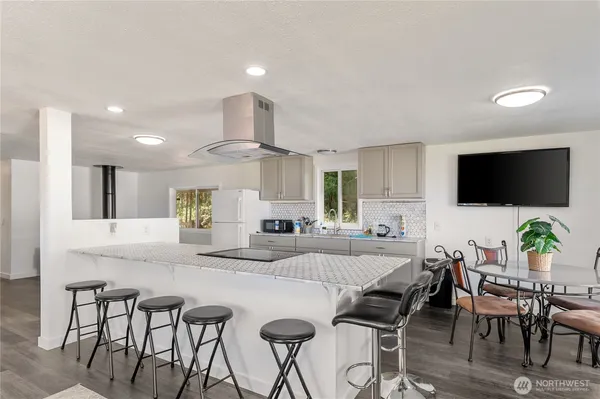 a kitchen with a table and chairs in it