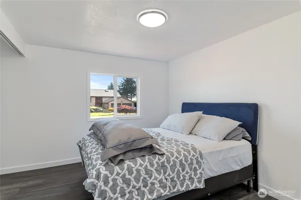 a bathroom with a shower sink vanity mirror and toilet