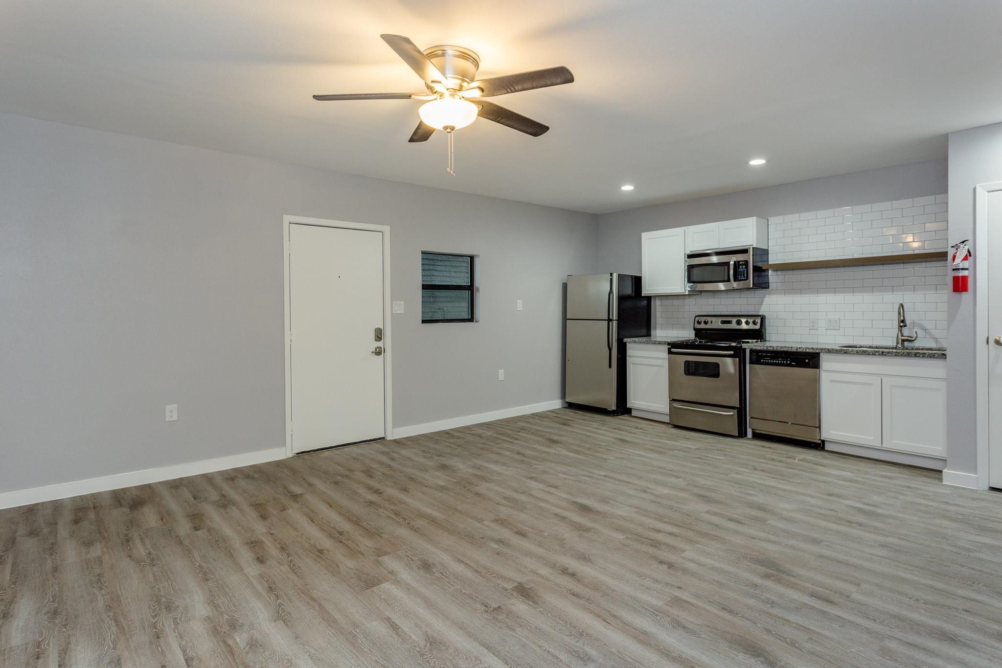 2810 Beauchamp Street, Unit 28 Houston, TX 77009 - Photo 3 of 12 a view of kitchen with granite countertop cabinets and stainless steel appliances