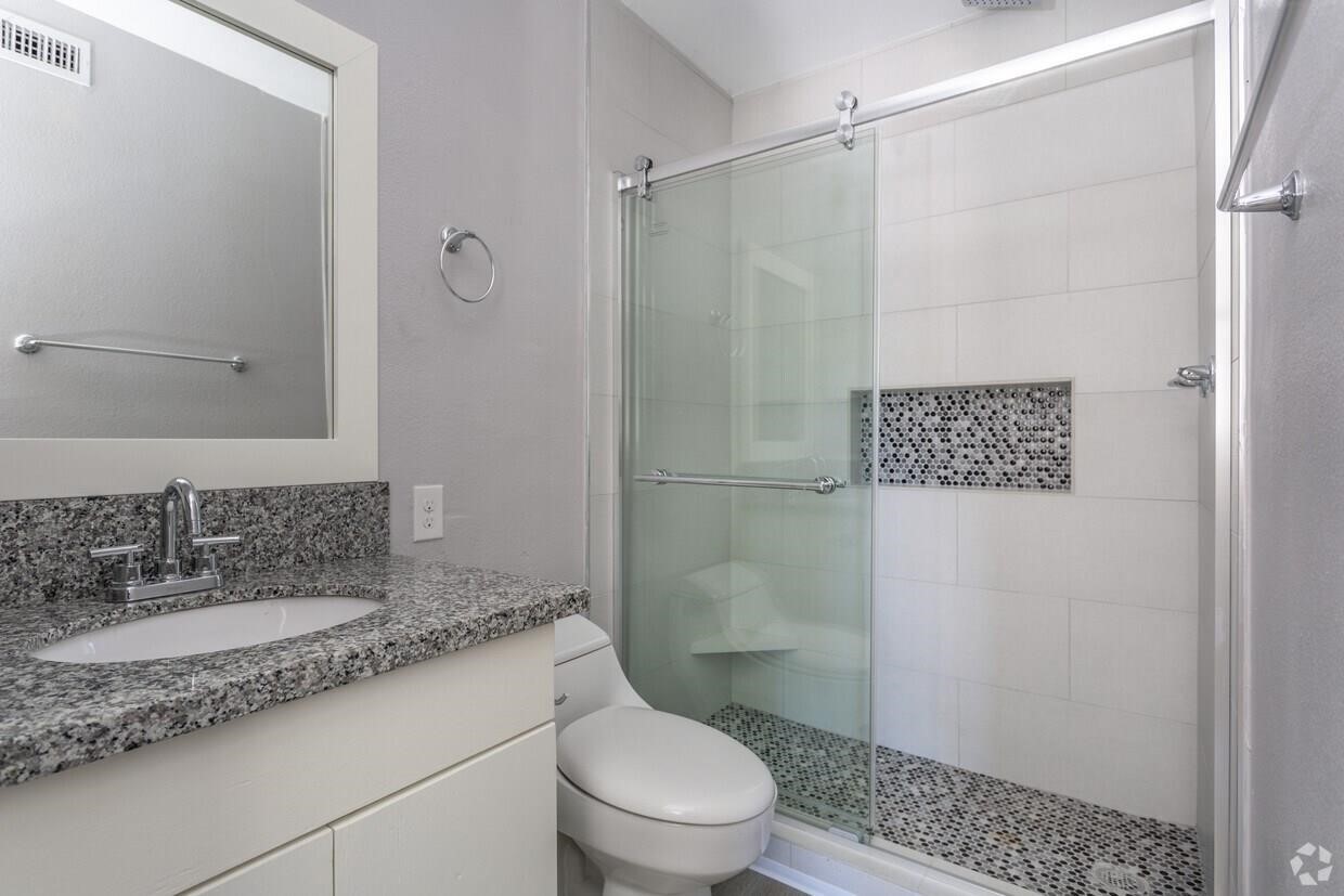 2810 Beauchamp Street, Unit 28 Houston, TX 77009 - Photo 4 of 12 a bathroom with a granite countertop sink toilet and shower
