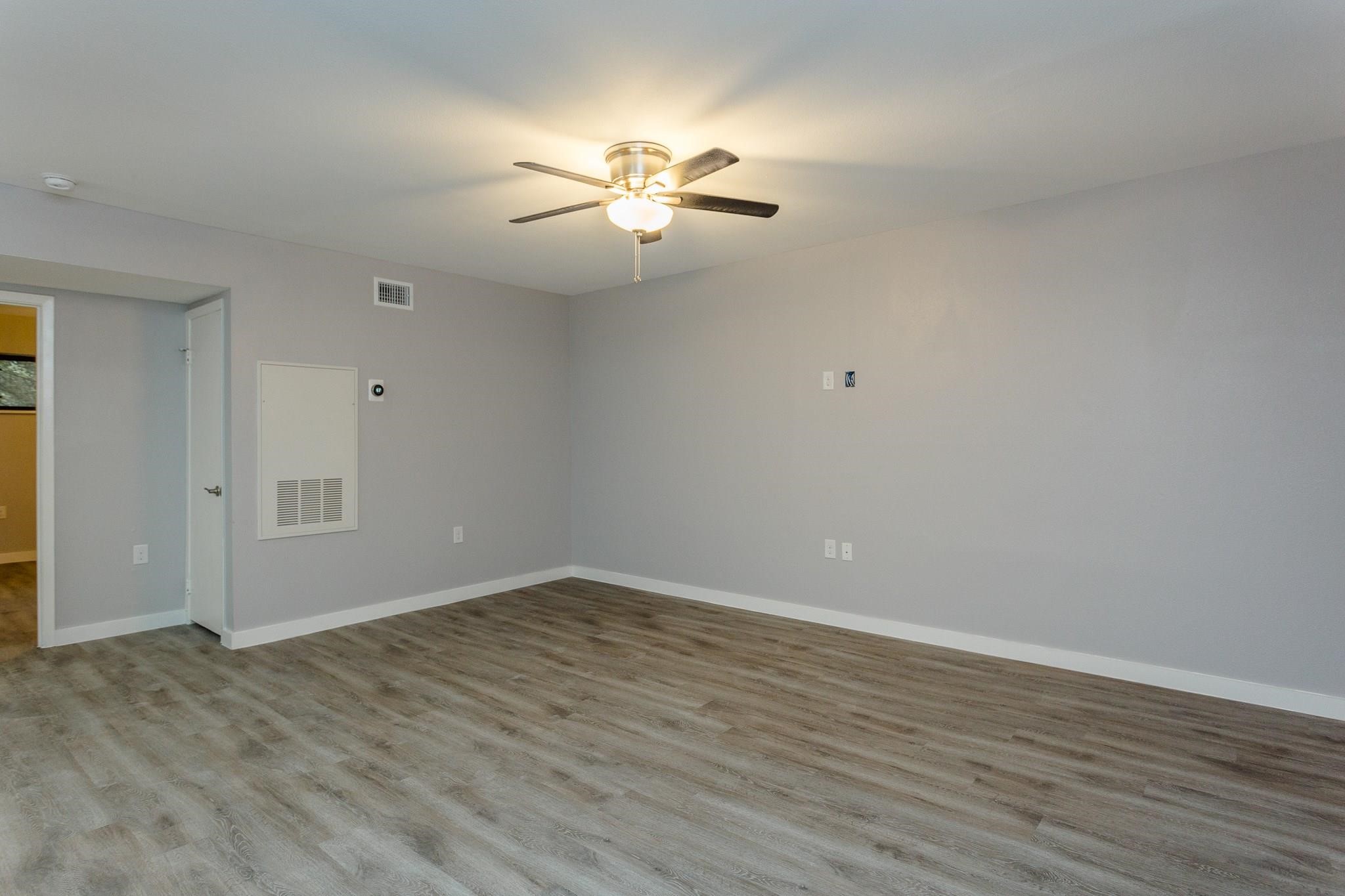 2810 Beauchamp Street, Unit 28 Houston, TX 77009 - Photo 5 of 12 a view of an empty room with wooden floor