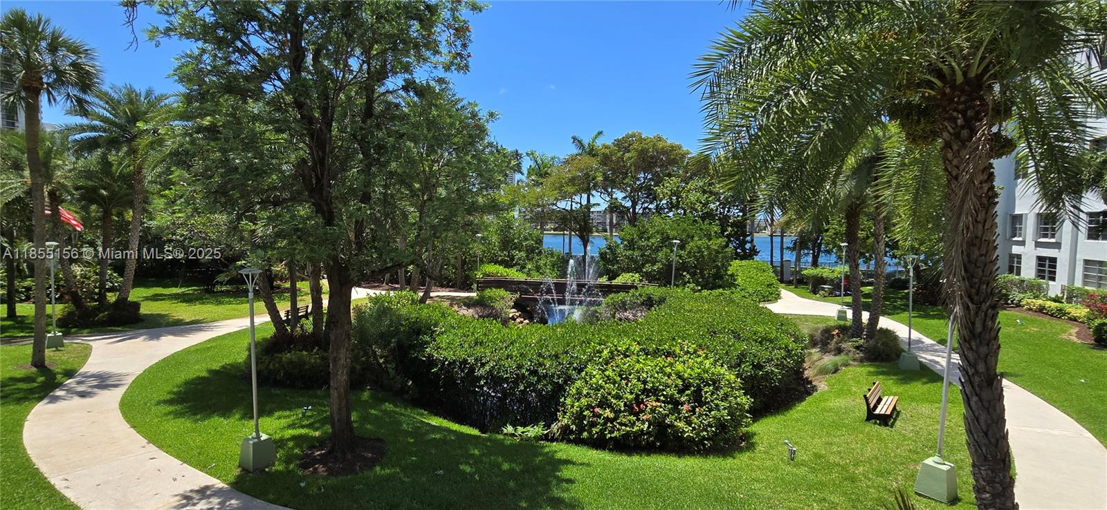 2801 Northeast 183rd Street, Unit 714W Aventura, FL 33160 - Photo 19 of 21 a backyard of a house with a garden and outdoor seating