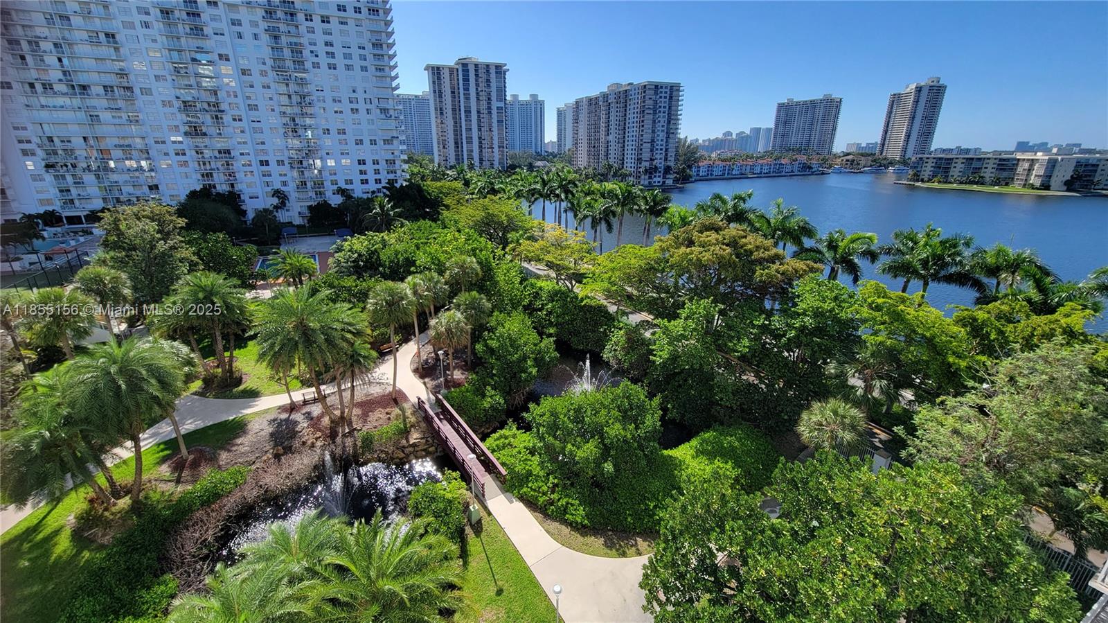 2801 Northeast 183rd Street, Unit 714W Aventura, FL 33160 - Photo 2 of 21 a view of a garden with a building in the background