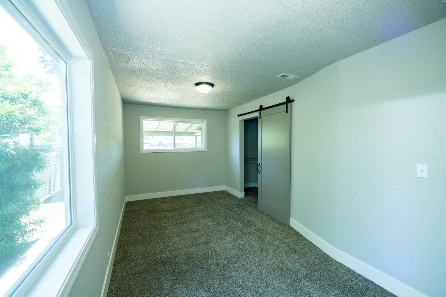 1136 East Griffith Way Fresno, CA 93704 - Photo 20 of 33 a view of an empty room and window