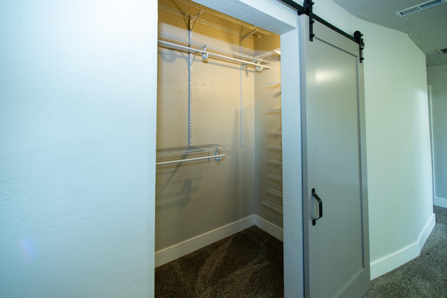 1136 East Griffith Way Fresno, CA 93704 - Photo 21 of 33 a bathroom with a glass shower door