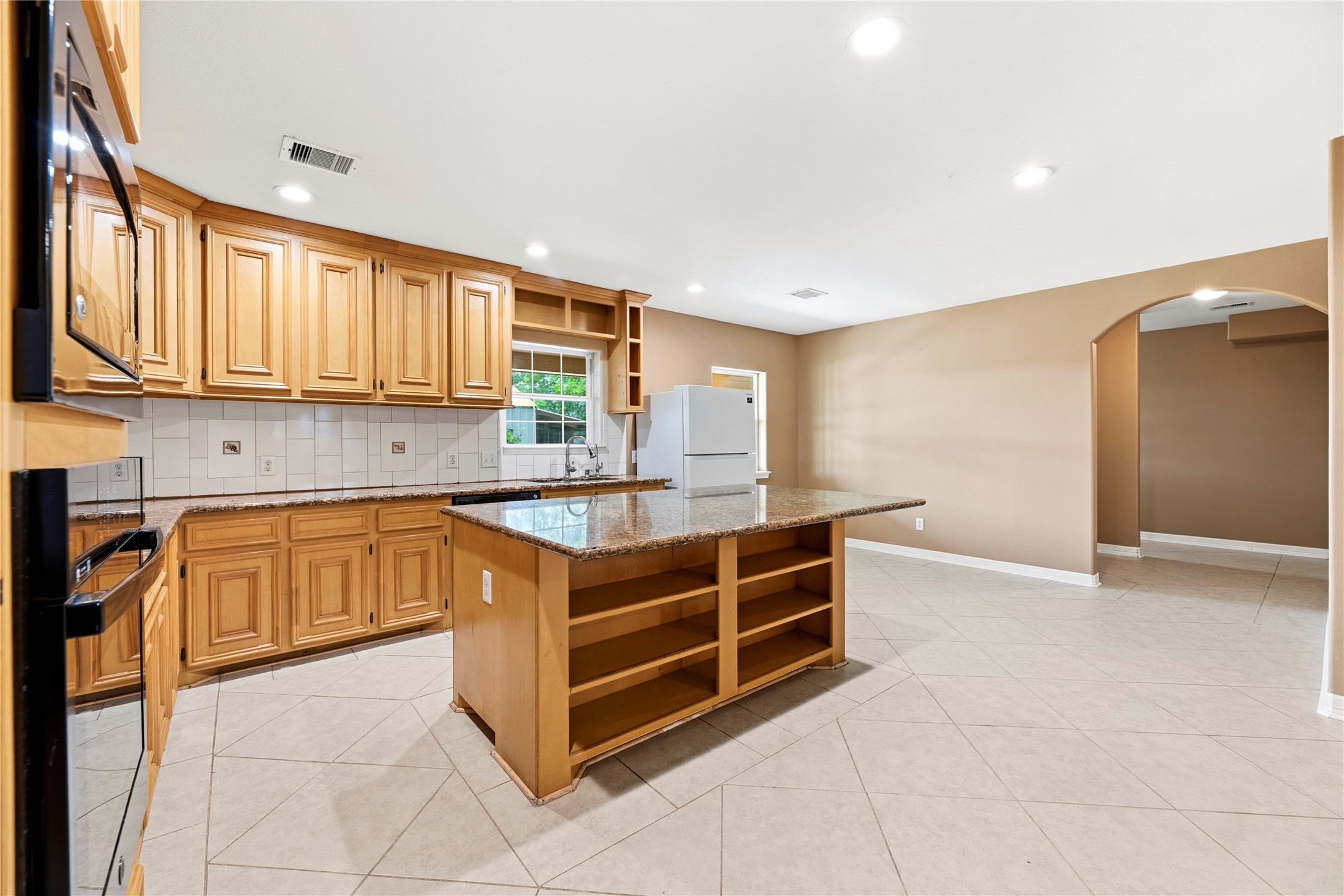 523 Moore Bar Road Rosenberg, TX 77471 - Photo 35 of 50 The kitchen features lots of cabinets and counter space.