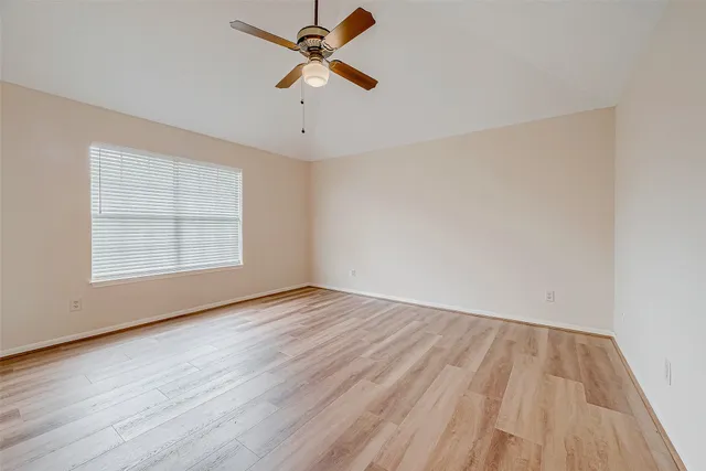 a spacious bathroom with a tub shower and sink