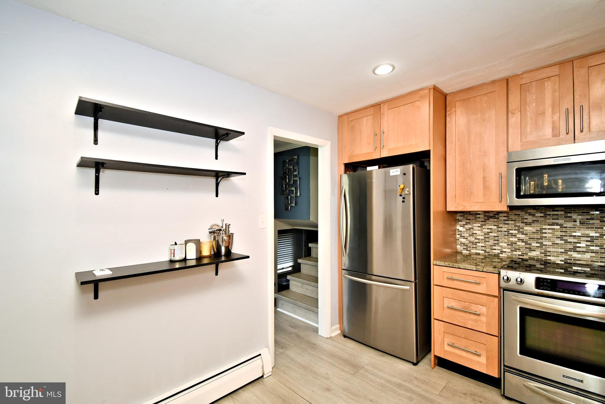 7 Sandy Drive Yardley, PA 19067 - Photo 12 of 42 a kitchen with stainless steel appliances a refrigerator stove and microwave