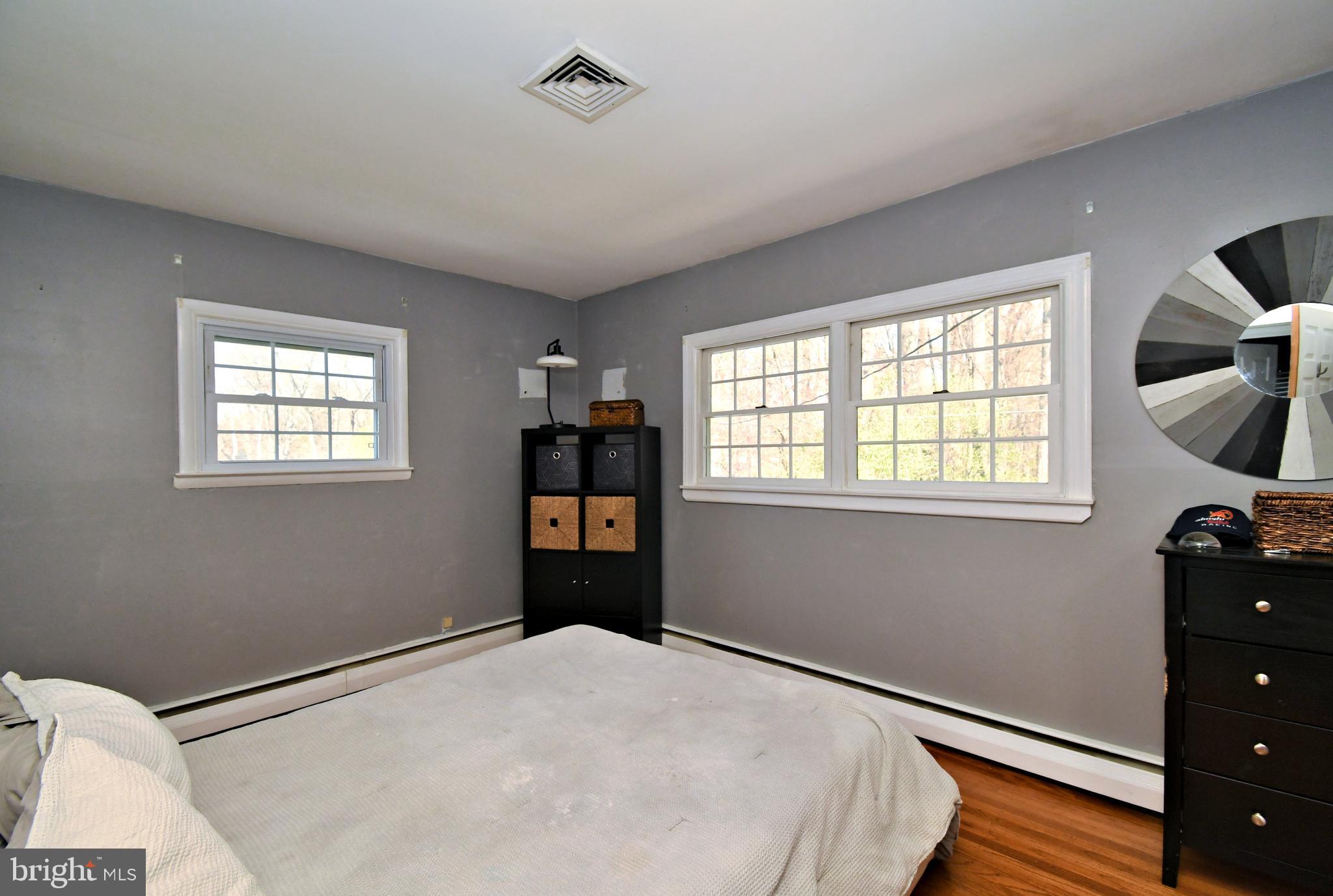 7 Sandy Drive Yardley, PA 19067 - Photo 16 of 42 a bedroom with a bed and a window