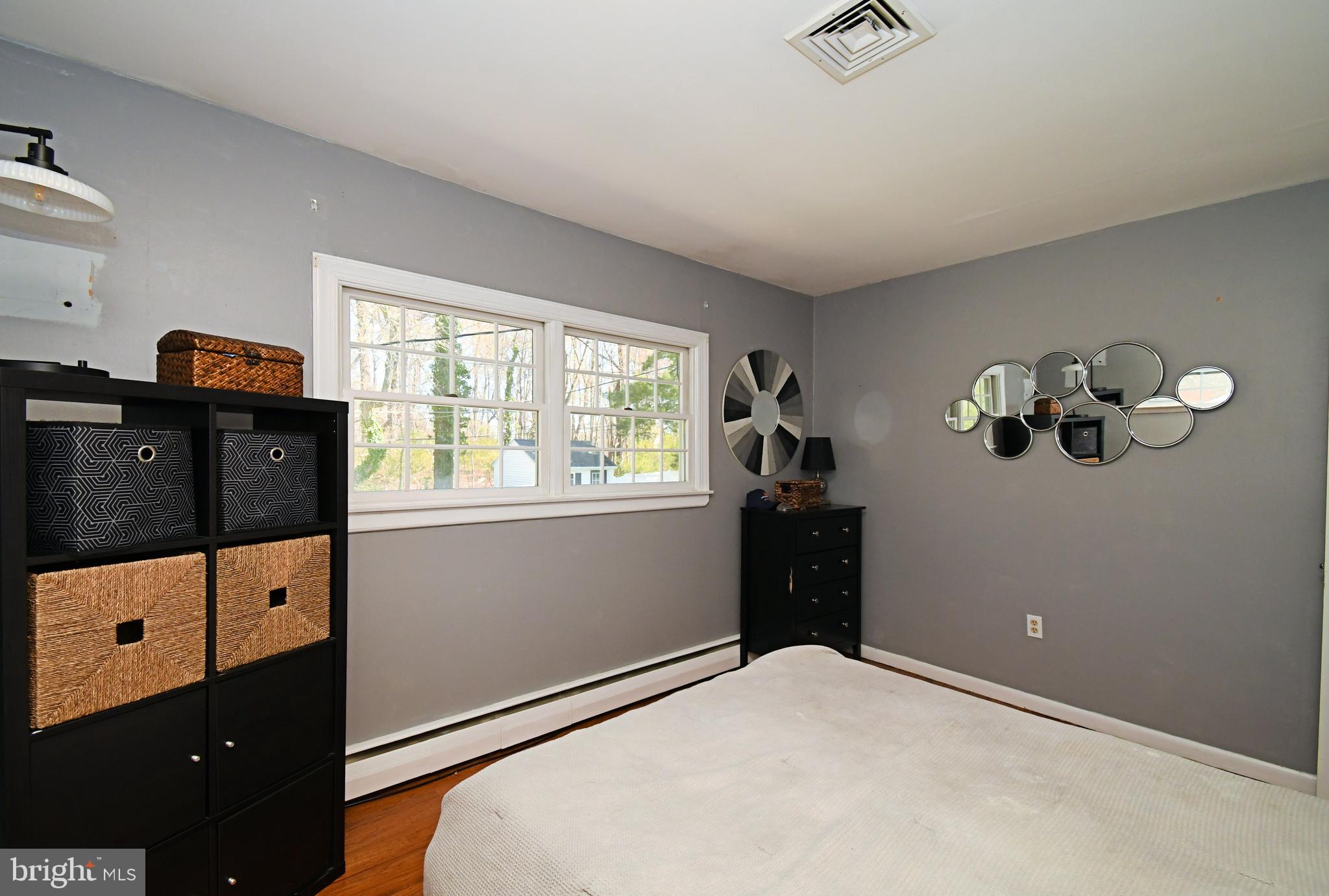 7 Sandy Drive Yardley, PA 19067 - Photo 17 of 42 a bedroom with a bed and a dresser