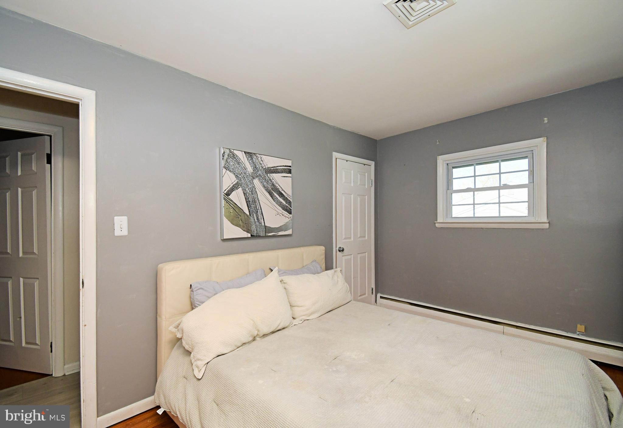 7 Sandy Drive Yardley, PA 19067 - Photo 18 of 42 a bedroom with a bed and a window