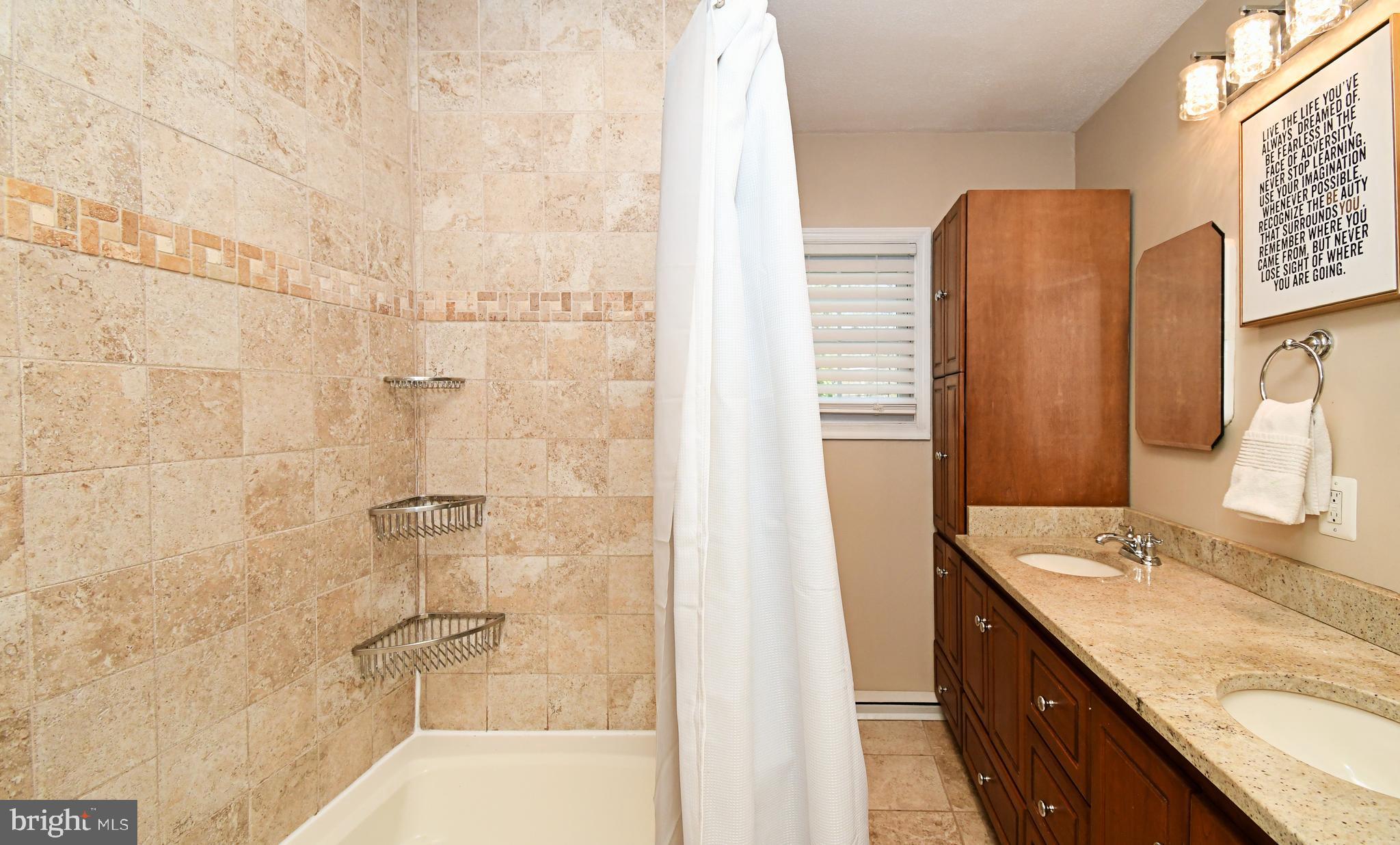 7 Sandy Drive Yardley, PA 19067 - Photo 24 of 42 a bathroom with a granite countertop shower sink and vanity