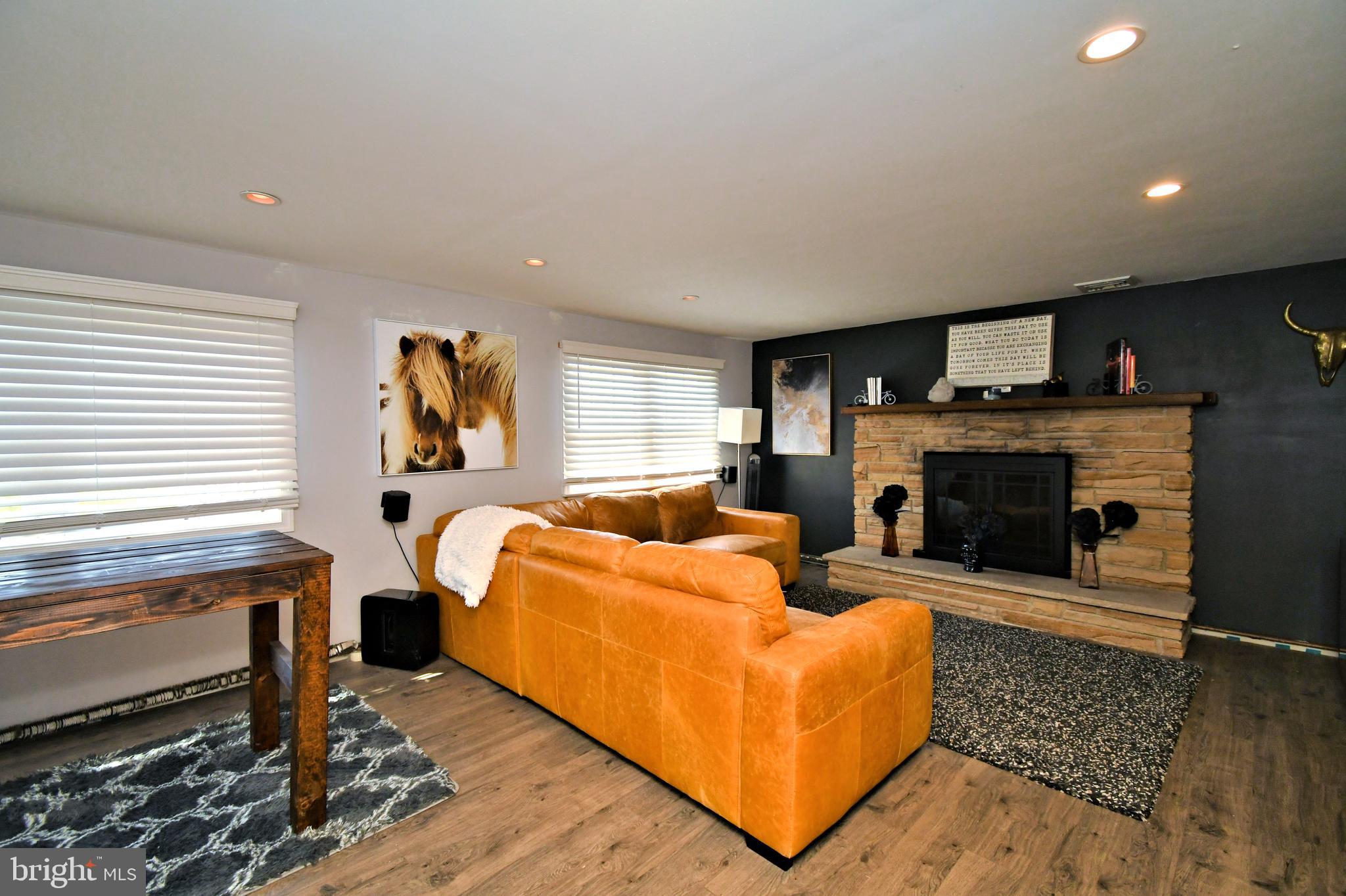 7 Sandy Drive Yardley, PA 19067 - Photo 26 of 42 a living room with furniture and a fireplace