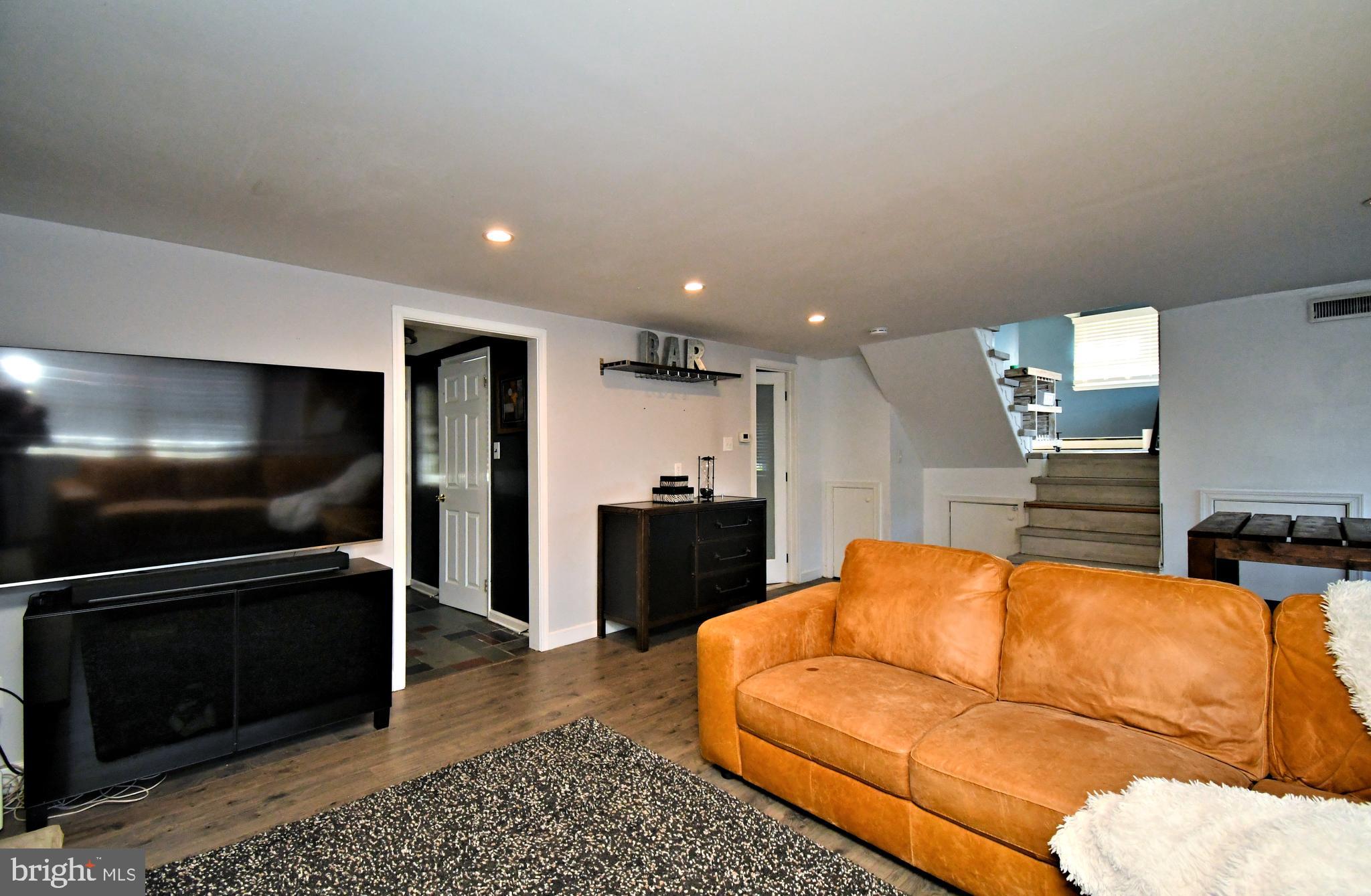 7 Sandy Drive Yardley, PA 19067 - Photo 29 of 42 a living room with furniture and a flat screen tv