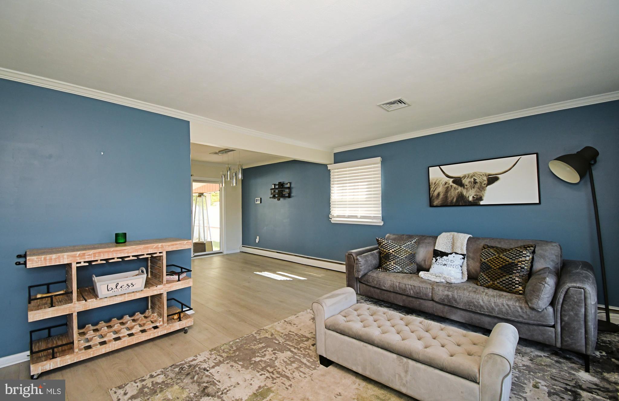 7 Sandy Drive Yardley, PA 19067 - Photo 4 of 42 a living room with furniture a rug and a window