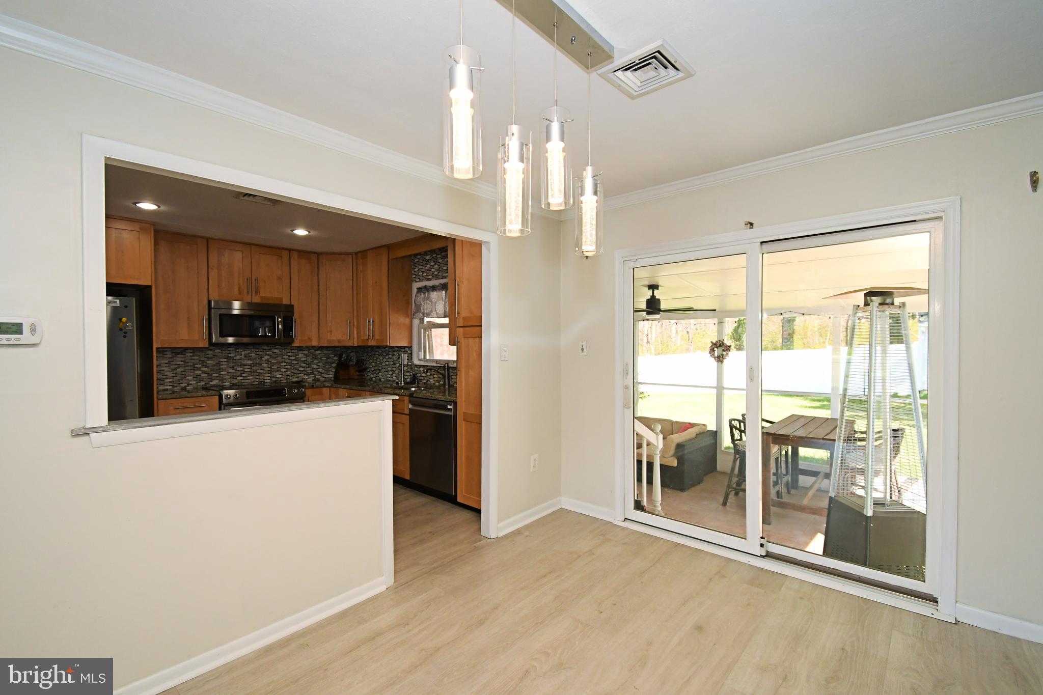 7 Sandy Drive Yardley, PA 19067 - Photo 10 of 42 a kitchen with a refrigerator and a view of living room