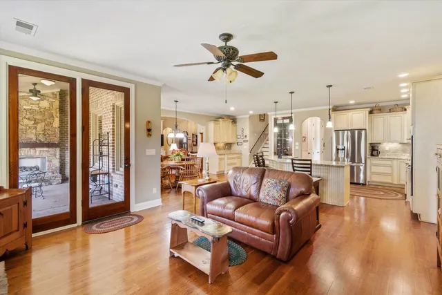 a living room with furniture and a fireplace