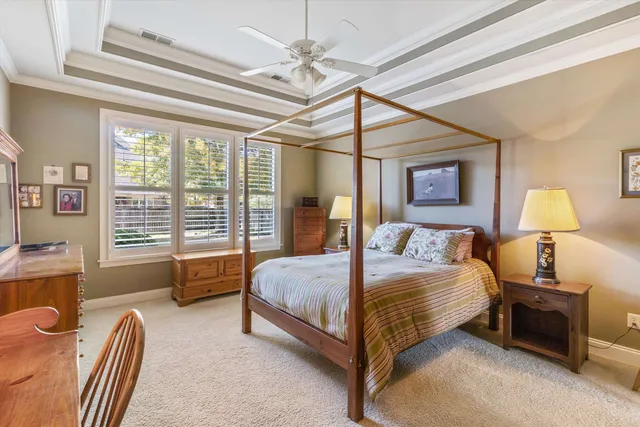 a bathroom with a granite countertop sink and a washing machine