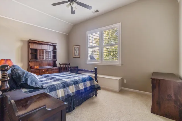 a bathroom with a bathtub shower sink vanity and mirror