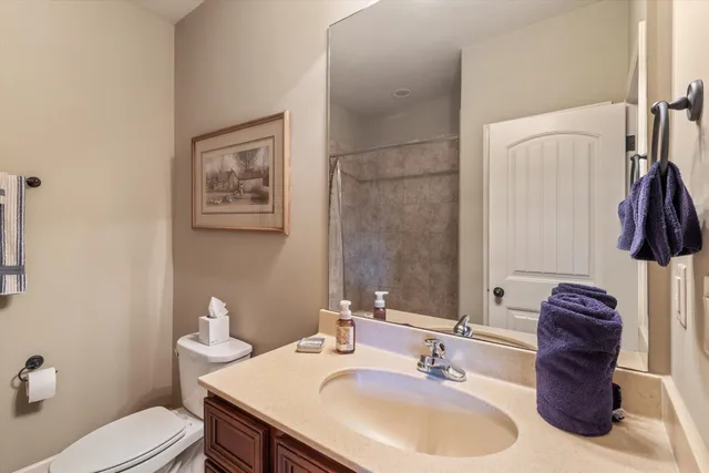 a bedroom with a bed and a lamp