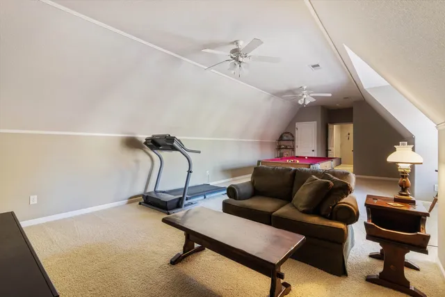 a room with pool table and flat screen tv