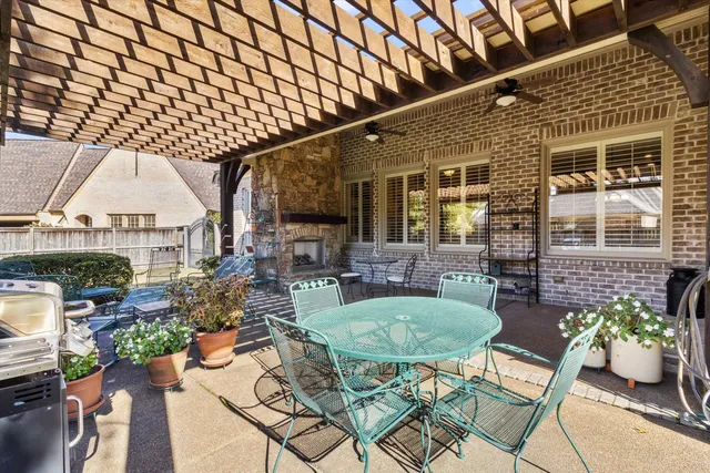 a outdoor living space with furniture and a fireplace