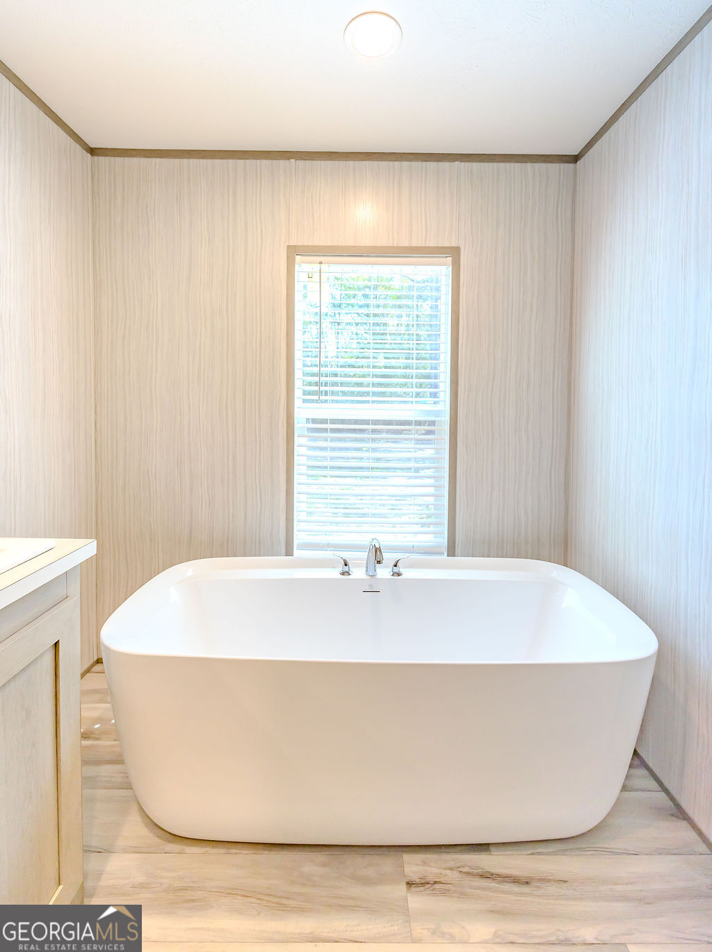 226 Mullis Street Dexter, GA 31019 - Photo 15 of 37 a white bath tub sitting in a bathroom