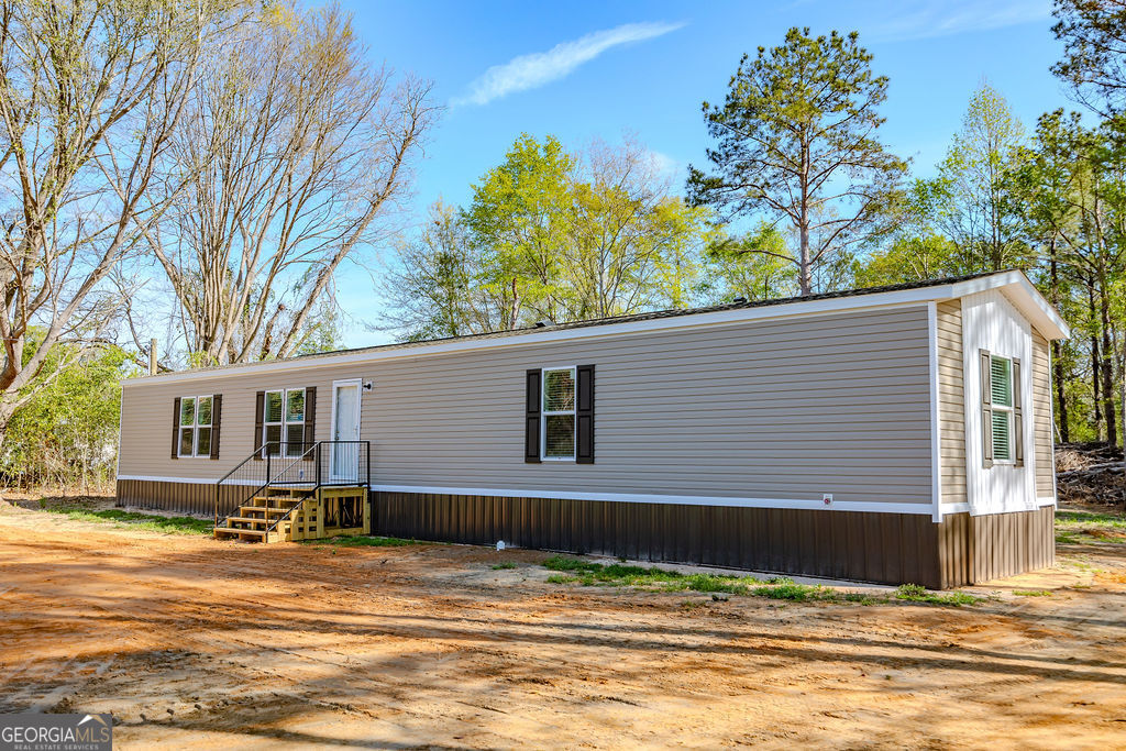226 Mullis Street Dexter, GA 31019 - Photo 2 of 37 a house view with a outdoor space